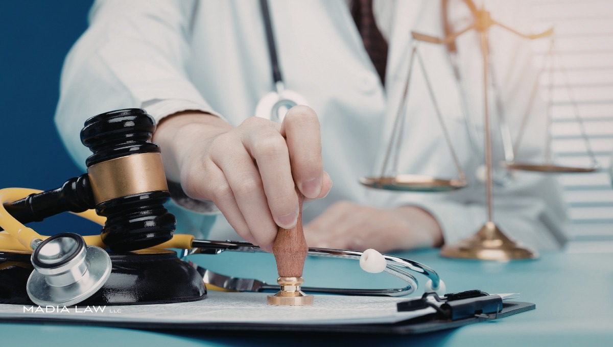 A healthcare professional in a white coat using a notary stamp on legal documents, surrounded by a judge's gavel, a stethoscope, and the scales of justice, representing a dental malpractice lawsuit.