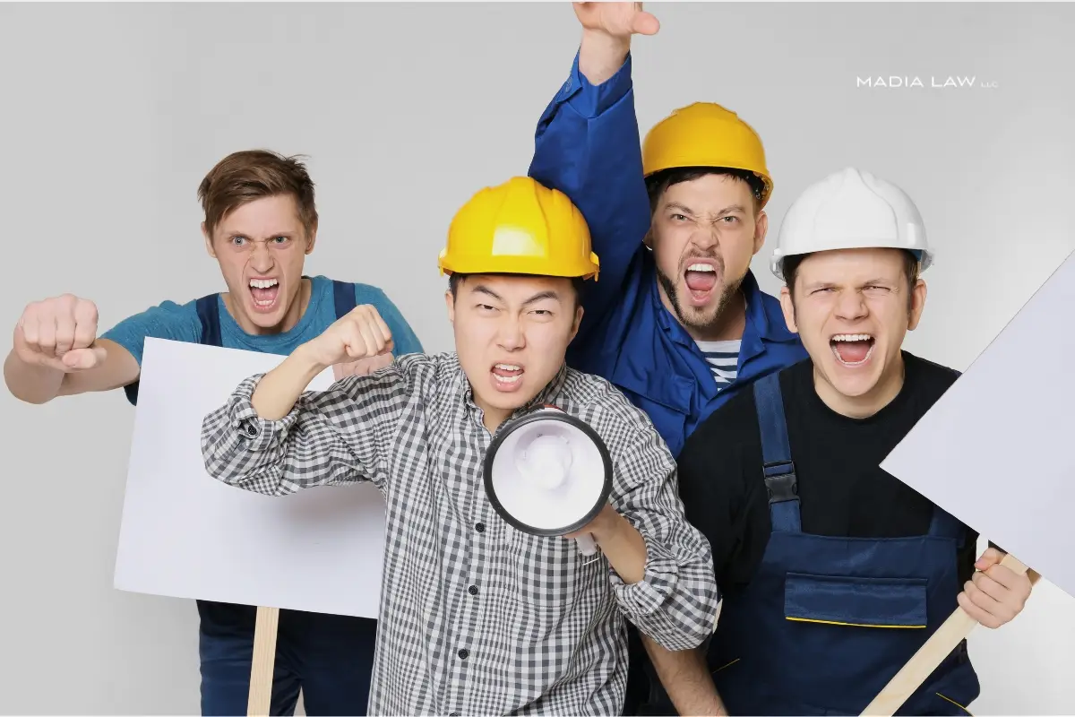A group of worker protesting unpaid wages minneapolis
